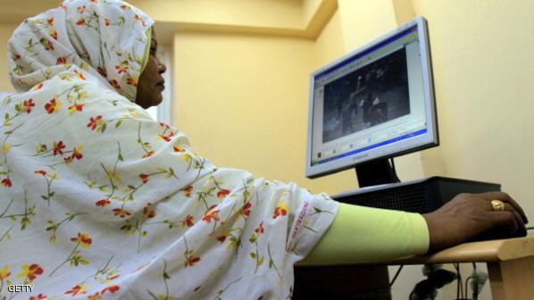 A Sudanese woman browses the internet at